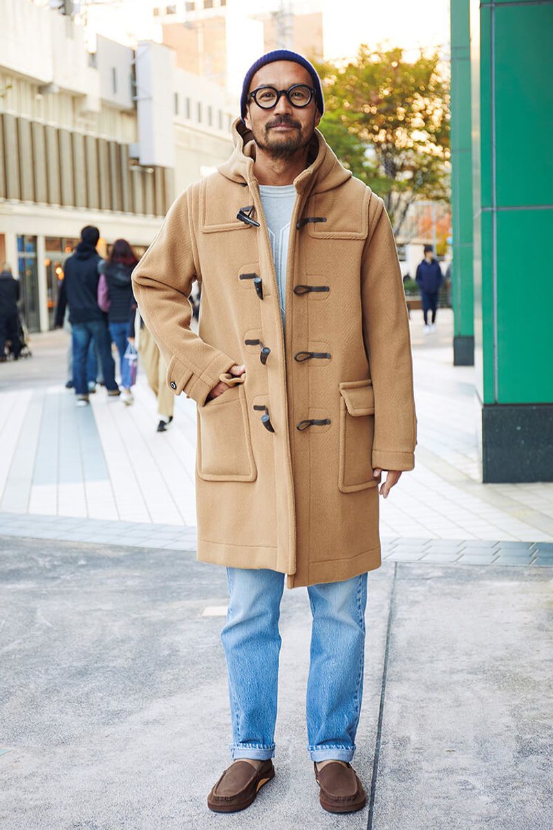 こんがり日焼けによく似合う淡いトーンのダッフルコート 田月大介